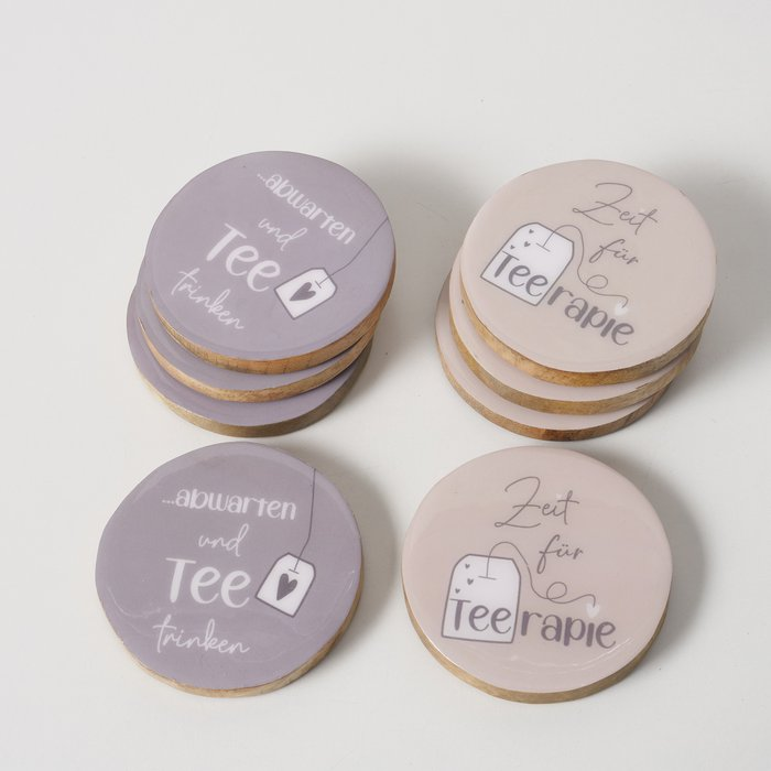 Untersetzer Tee 4-tlg. – alle vier Motive Beige und Grau auf grauem Hintergrund